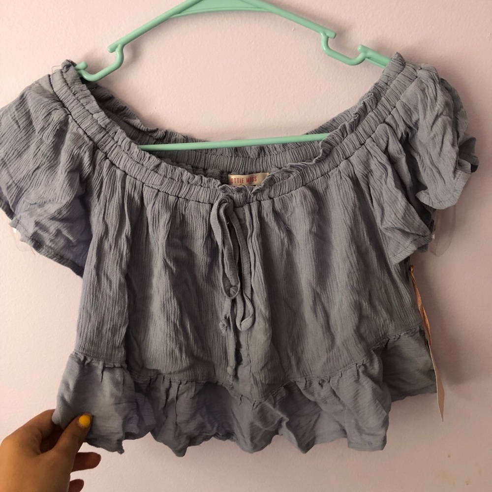 Lottie Moss off the shoulder blue gray top